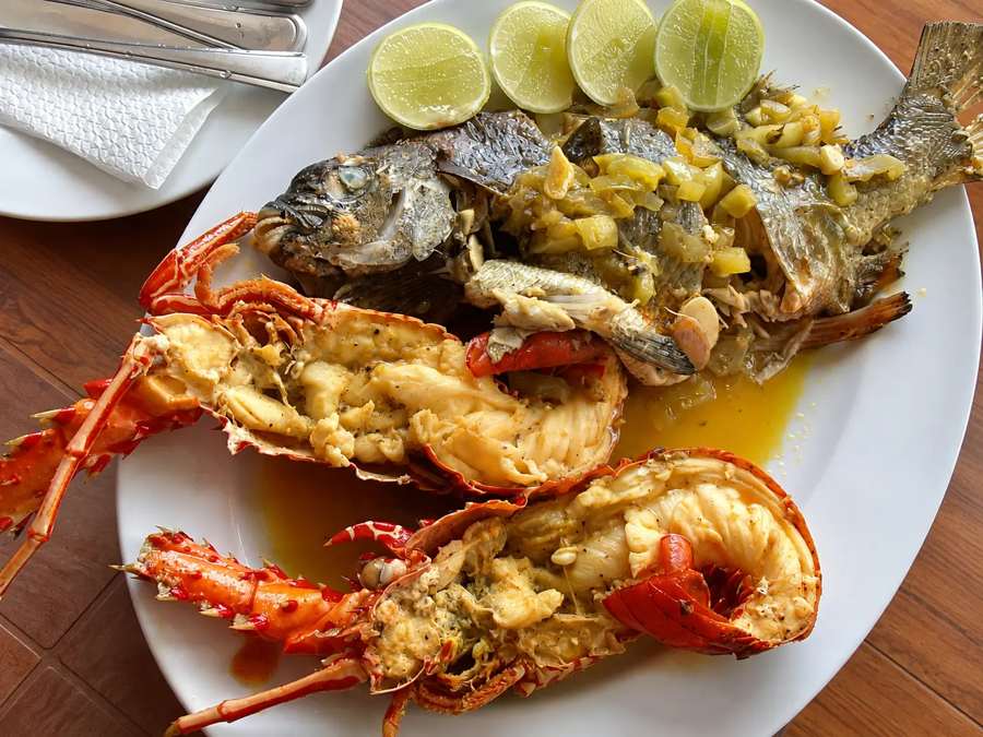 Grilled lobster and whole fish with lime at the hotel restaurant